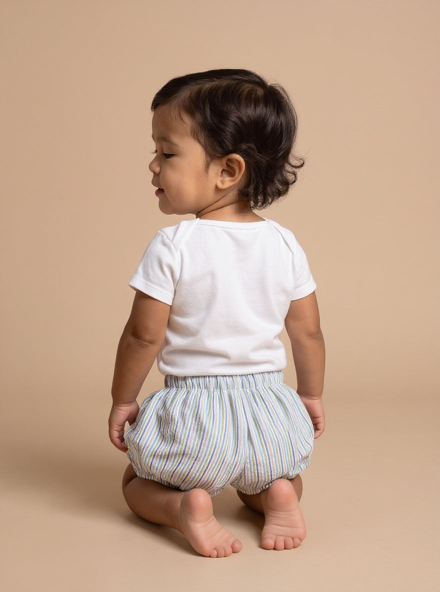 Bébé fille à genoux de dos en bloomer Romy thyme